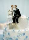 Whimisical Sitting Bride and Groom Wedding Cake Topper